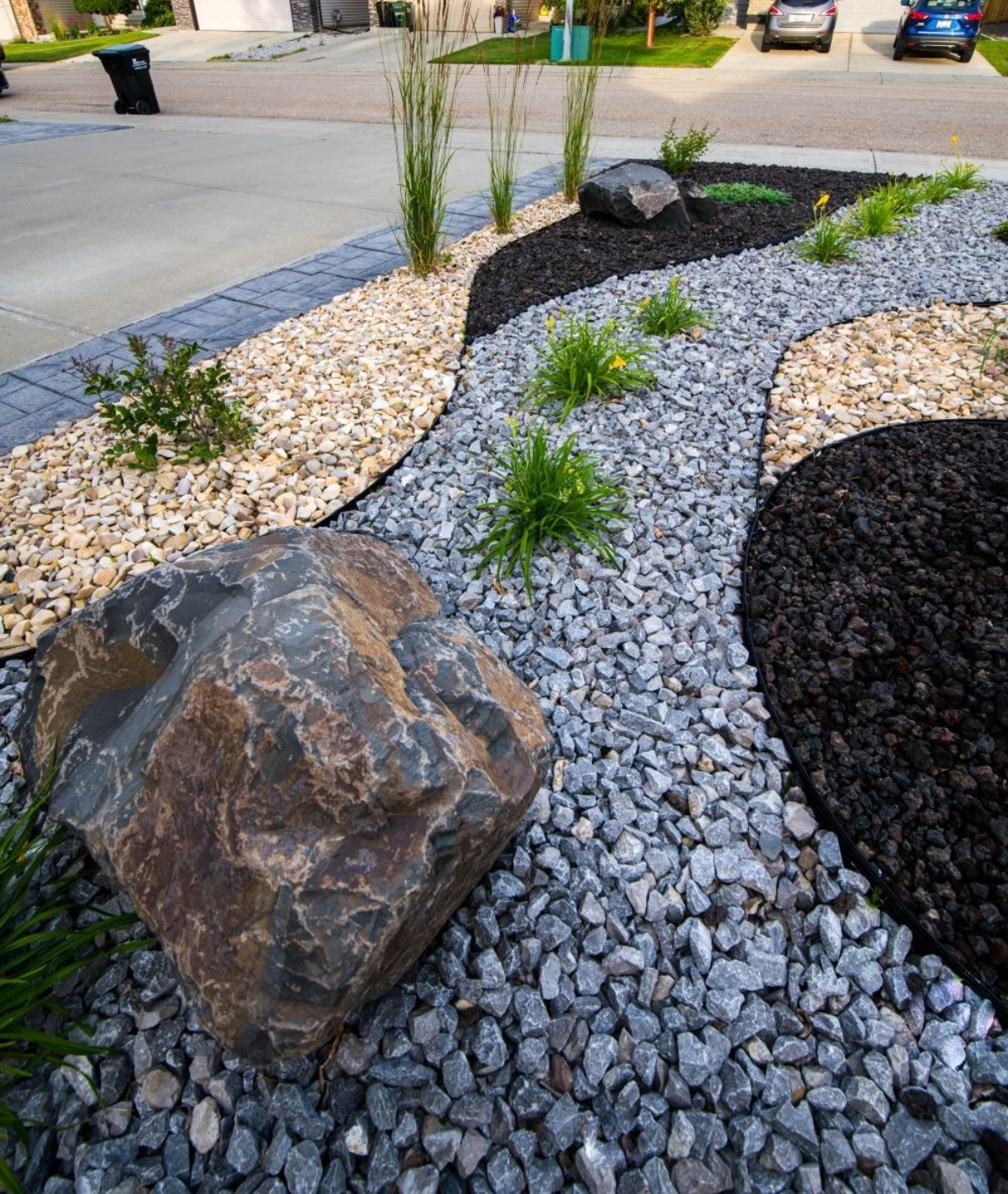 Modern xeriscape with mixed rock, boulder and drought-tolerant plants